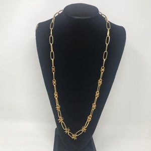 Gold tone knot (flower) chain